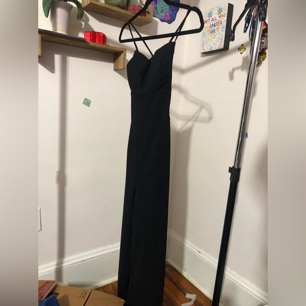 Black open back romper.